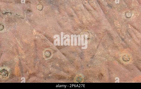 Steampunk Abstract background of old riveted copper sheet cladding. Grunge texture full frame Stock Photo