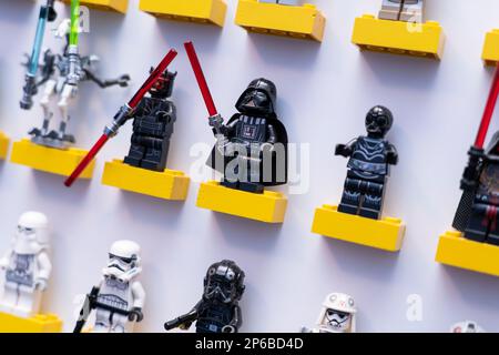 Darth Vader and Darth Maul from the Galactic Empire and Sith Star Wars lego figures standing on lego bricks in a wall mounted picture frame. UK Stock Photo