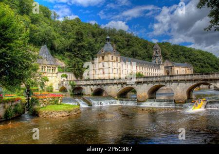 A Bridge over the River Dronne and the Famous Brantome Abbey in Brantome, France Stock Photo