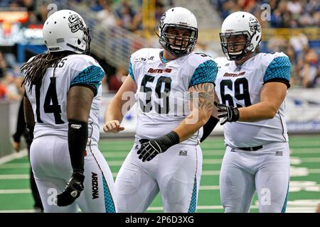 May 26, 2012: Arizona Rattlers linemen Kyle Young #59 celebrates with  teammates Michael Huey #69 and Sir Vincent Rodgers #74 during the AFL  football game between the New Orleans Voodoo and the