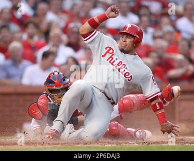 San Diego Padres catcher Carlos Hernandez, top, is upended by Atlanta Braves  relief pitcher John Rocker as he scores a run in the eighth inning Monday,  Oct. 12, 1998, during Game 5