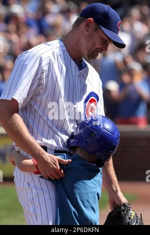 Kerry Wood greets his son Justin after he was taken out during the eighth  inning of a baseball game against the Chicago White Sox, Friday, May 18,  2012, in Chicago. The White