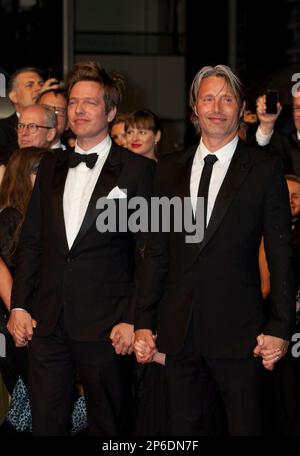 Actor Mads Mikkelsen Left And Director Thomas Vinterberg Pose During A Photo Call For The Hunt