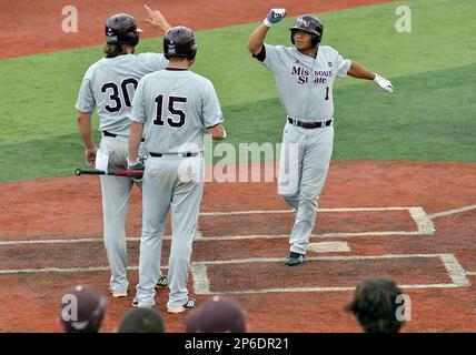 Luke Voit #30 of the Missouri State Bears follows through his swing after  making contact on a pitch during a game against the Wichita State Shockers  at Hammons Field on May 5