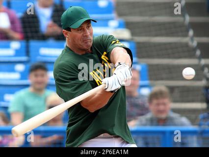 Former Major League Baseball player Jose Canseco takes a swing during the  Battle For Vegas Char …