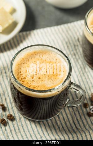 Warm Bulletproof Butter Coffee in a Glass Mug Stock Photo