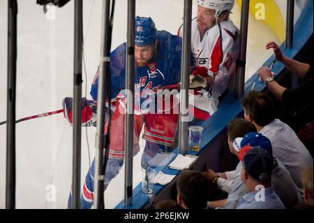 The New York Rangers team surround Henrik Lundqvist when time runs out in  the game against the Montreal Canadiens in game 6 of the NHL Eastern  Conference finals in the 2014 Stanley