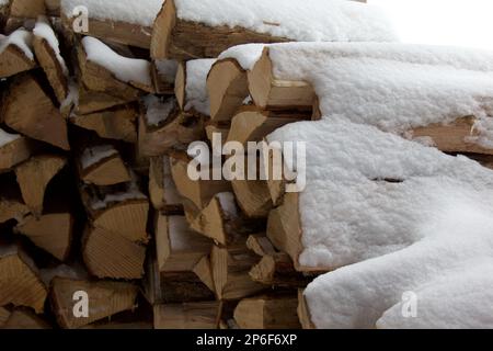 snowy firewood pile Stock Photo