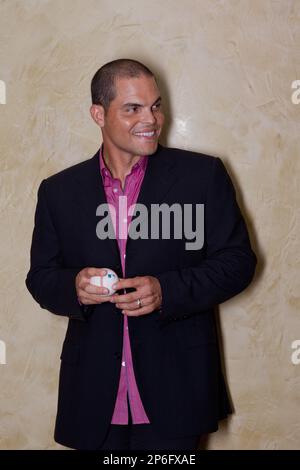 Hall of Fame catcher Ivan Pudge Rodriguez acknowledges cheers from fans  as he prepares to catch the final ceremonial pitch in a postgame event at  Globe Life Field following a contest between