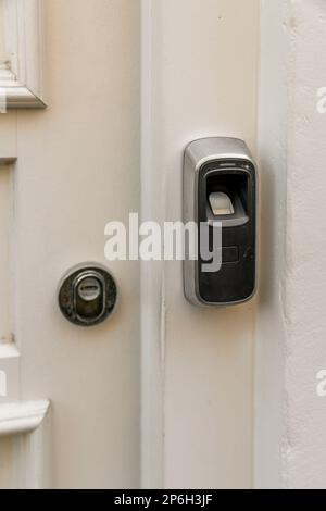 Amsterdam, Netherlands - 10 April, 2021: an open door with a key in the lock and two keys attached to the side of the door that is closed Stock Photo