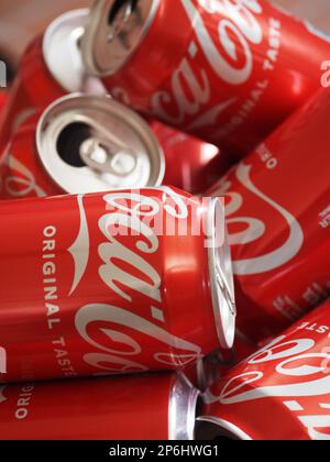 In this photo illustration, empty Coca-Cola cans seen displayed. Stock Photo