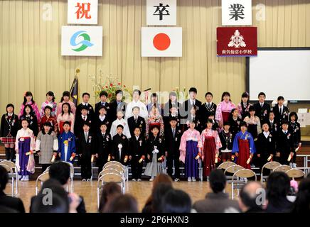 The sixth-grade students of Minami Kesennuma Elementary School, attired in  Japanese formal dress hakama, attend their graduation ceremony in  Kesennuma, Miyagi Prefecture, on March 19, 2012. The elementary school, hit  by the