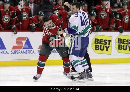 February 9, 2012: Minnesota Wild defenseman Nate Prosser #39 and Vancouver  Canucks right wing Alex Burrows #14 exchange words during an NHL hockey  game between the Minnesota Wild and the Vancouver Canucks