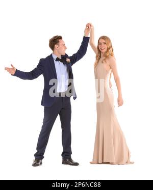 Beautiful couple dressed for prom dancing on white background Stock Photo