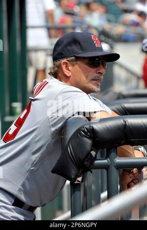 St. Louis Cardinals third base coach Jose Oquendo walks in the dugout  wearing the uniform of the St. Louis Stars of the Negro League before a  baseball game against the Pittsburgh Pirates