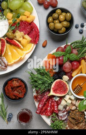 Set of different delicious appetizers served on light grey table, flat lay Stock Photo