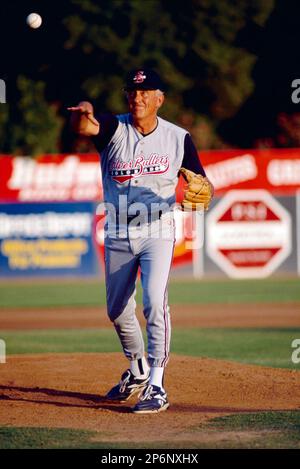 Former Atlanta Braves pitcher Phil Niekro throws out a pitch while managing  the Colorado Silver Bullets during a 1995 game at Fiscalini Field in San  Bernardino,California.(Larry Goren/Four Seam Images via AP Images