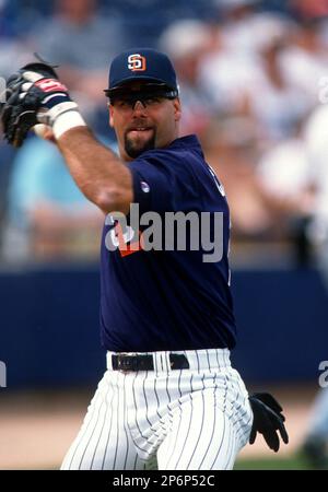 Glenn Caminiti, the brother of the late baseball player Ken Caminiti,  embraces his wife, Debbie, during a ceremony honoring his brother prior to  the game between the San Diego Padres and the