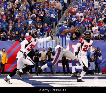 Atlanta Falcons James Sanders and Dunta Robinson (23) stand near New York  Giants Mario Manningham as he makes a 27 yard touchdown reception in the  fourth quarter in the NFC Wild Card