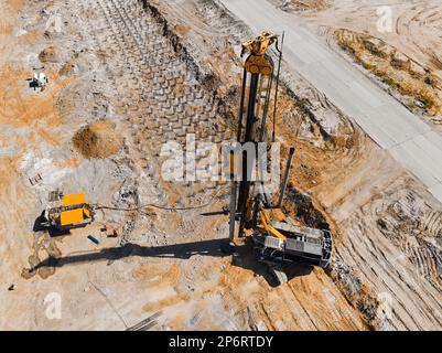 Drilling rig for constructing new mine on pile field Stock Photo - Alamy