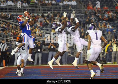 https://l450v.alamy.com/450v/2p6tkxg/december-21-2011-san-diego-ca-louisiana-tech-bulldogs-wide-receiver-taulib-ikharo-17-attempts-to-catch-a-pass-after-it-is-tipped-by-tcu-horned-frogs-safety-johnny-fobbs-21-in-the-first-half-of-the-san-diego-county-credit-union-poinsettia-bowl-college-football-game-between-the-louisiana-tech-bulldogs-and-the-tcu-horned-frogs-at-qualcomm-stadium-in-san-diego-ca-david-hoodcal-sport-media-cal-sport-media-via-ap-images-2p6tkxg.jpg
