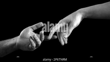 Helping hand. Giving a helping hand. Solidarity, compassion, and charity rescue. Stock Photo