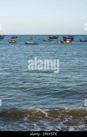 Local fishing boats on sea. Vintage colourful boats with fishing nets. Stock Photo