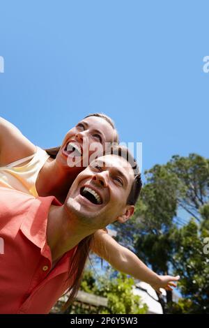Best airline service she experienced. A young couple having fun outdoors on a sunny day. Stock Photo