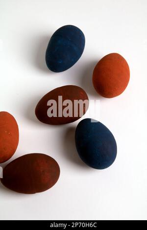 photo of different colored eggs on a white background Stock Photo