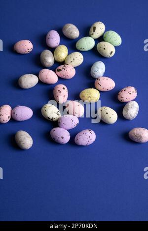 photo of many small eggs on a blue background Stock Photo