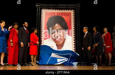 A large poster featuring a stamp of Barbara Jordan is on display