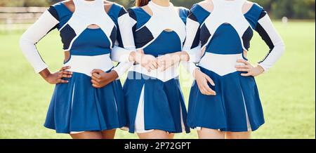 cheerleader teen girl in sports blue and yellow clothes jump over yellow  background Stock Photo - Alamy