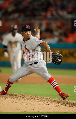 St. Louis Cardinals (L to R) Yadier Molina and Rafael Furcal along with (R  to L) Albert Pujols and Octavio Dotel pose for a photograph with Domician  singer Hector Acosta before a