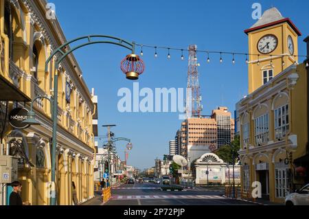 The old Standard Chartered Bank bldg. (l) and clocktower in the Old Town area of Phuket Town, Phuket, Thailand, the former now housing a museum Stock Photo