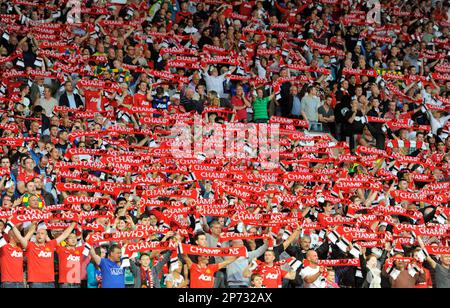 Manchester United fans hold up champion scarves at the beginning of the match..Barclays Premier League..Manchester United v Tottenham Hotspur..22nd August, 2011. (Cal Sports Media via AP Images)
