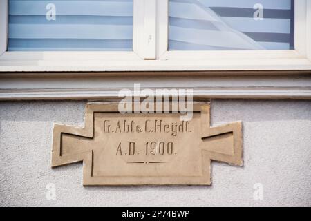 Old inscriptions carved stone on the facade of a house G. Abt and C. Heydt A.D 1900 Stock Photo