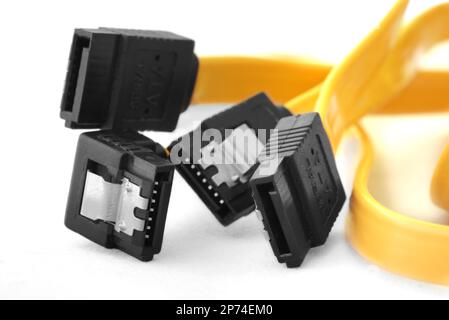 Serial ATA data cable and plug on white background Stock Photo