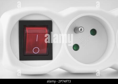 Electrical extension cord. White plug socket with switch Stock Photo
