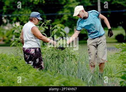 FOR RELEASE SATURDAY, JULY 23, 2011, AT 12:09 A.M. EDT - In this photo  taken July 8, 2011, Shawn and wife Geralyn Touhill with their children,  Shawn Jr,, 3-months, daughter Hayden, 5