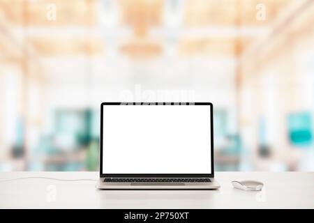 Modern laptop on office table with mouse with blank screen. Stock Photo