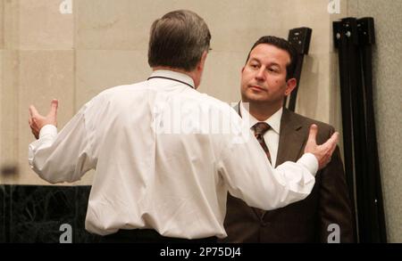 Former New England Patriots player Aaron Hernandez, left, at listens as his  attorney Jose Baez cross-examines witness Alexander Bradley during Hernandez'  trial at Suffolk Superior Court on Wednesday, March 22, 2017, in