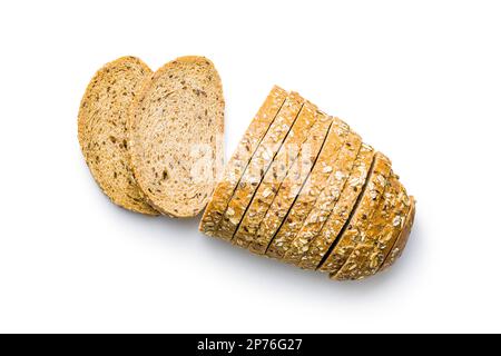 Sliced whole grain bread. Tasty wholegrain pastry with seeds isolated on the white background. Stock Photo