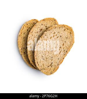 Sliced whole grain bread. Tasty wholegrain pastry with seeds isolated on the white background. Stock Photo