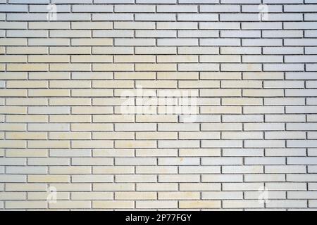 Background from a beige clinkered wall Stock Photo