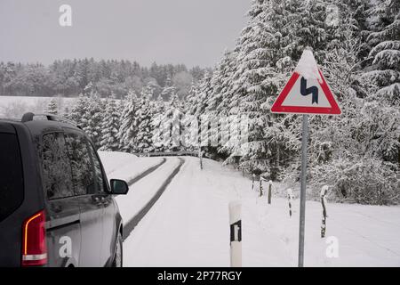 08 March 2023, Rhineland-Palatinate, Nürburg: After a winter blast, the roads in the Eifel region near the Nürburgring are covered in snow. Rain, snow and storms are expected to make the rest of the week quite uncomfortable, according to the DWD. Photo: Thomas Frey/dpa Stock Photo