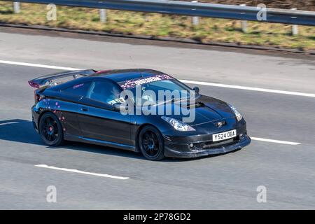'Obession' 2001 Black TOYOTA CELICA VVTI 1794cc 6 speed manual; travelling on the M61 motorway, UK Stock Photo