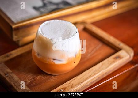 Close up iced thai milk tea in glass, selective focus Stock Photo