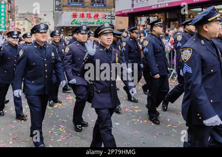 New York, Chinatown, USA - February 12, 2023: NYPD Asian Jade Society parading in front of the public during the Chinatown Chinese New Year 2023 celeb Stock Photo