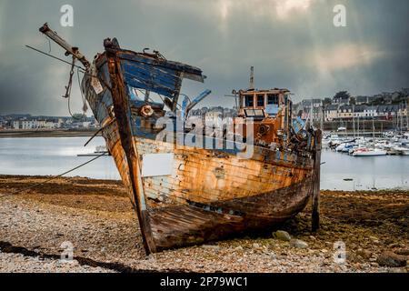 Old fishing boat in the ship graveyard of Camaret-sur-Mer, Finisterre, Brittany, France Stock Photo
