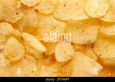 Potato chips texture background. Crispy and crunchy snack with a spicy kick Stock Photo